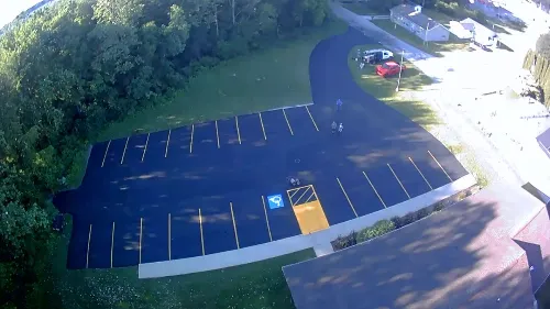 A newly sealcoated and striped commercial parking lot