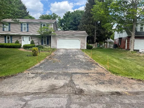 Residential driveway before asphalt paving service