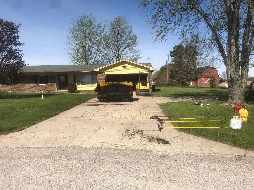 Residential driveway before asphalt paving service