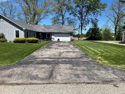 Residential driveway before sealcoating service