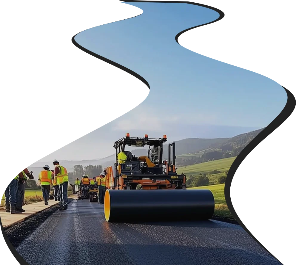 Brooks Brothers Driveways' asphalt contractors working on an asphalt road